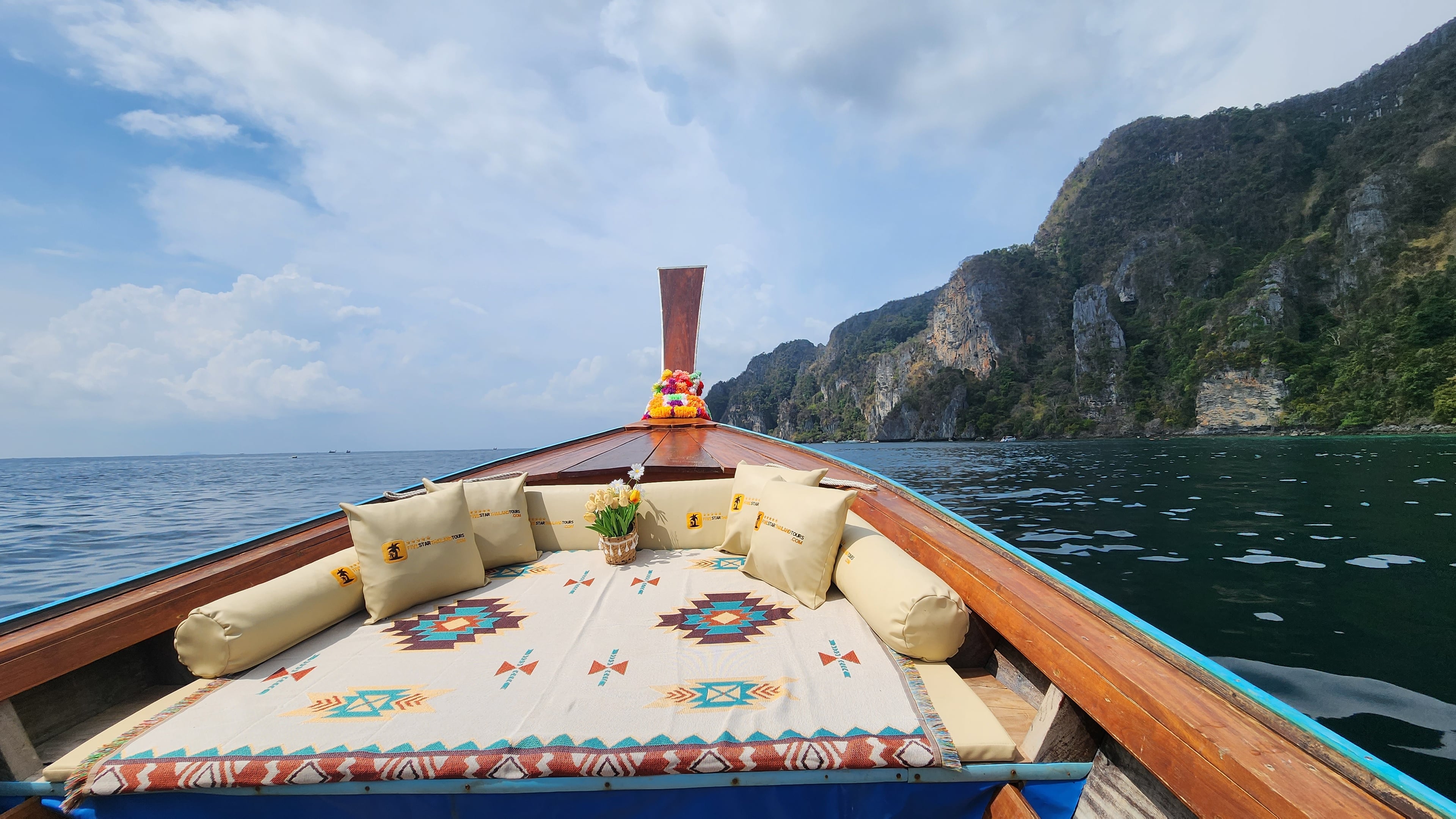 Phi Phi Islands Private Longtail Boat Tour - 04 outdoor open seating with pillows five star brand longtail boat