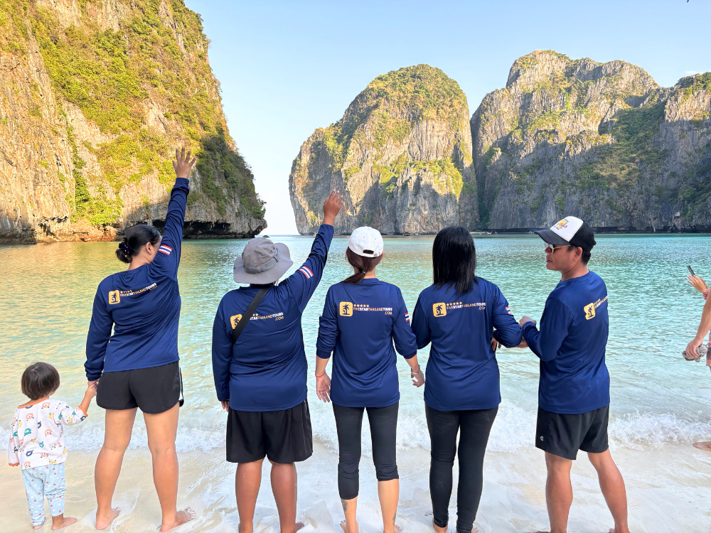 Five Star Thailand Tours Phi Phi Tour Guides Group Photo at Maya Bay Beach on a Phi Phi Tour